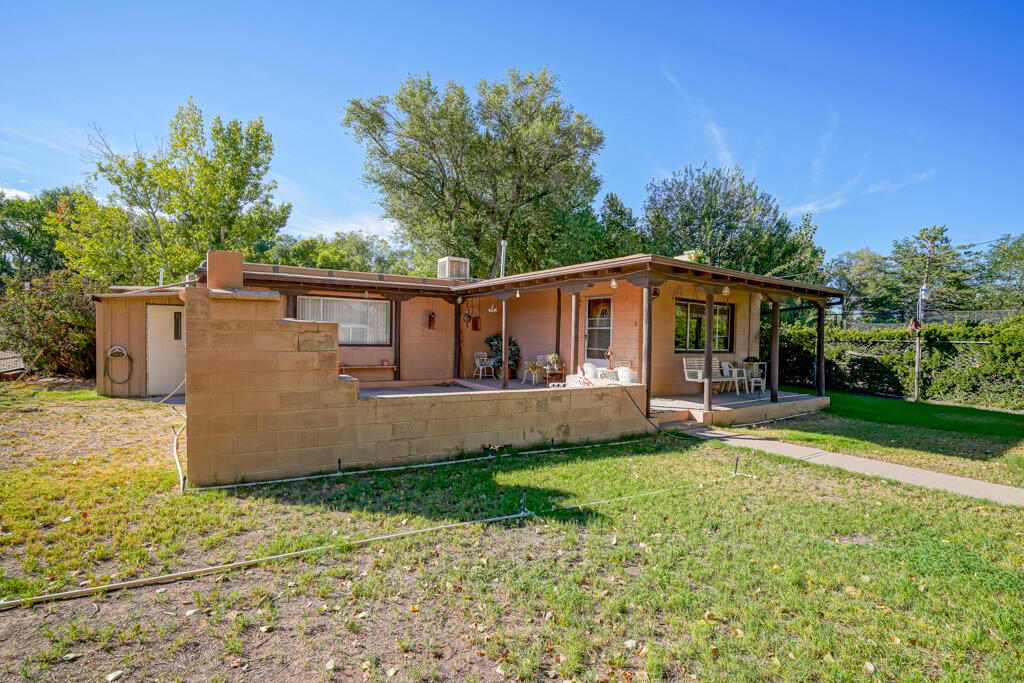 Unprecedented opportunity to own a piece of N Valley history,  Alameda Stables.  Over 2 acres of horse facilty along with 2 homes and a view of the majestic Sandias. Approx 27 stalls, all with weather break. 8 stalls are in the barn, the rest out. Large arena area, round pen,  hot walker & wash station. Welded pipe throughout. Spacious hay barn, tack room, equipment storage too. Original homes combined make 2200sf of living. Make into one home, or keep separate for stable hand, in law, rental etc. There's also an RV pad perfect for visitors to enjoy during Balloon Fiesta launch just to the East. Entire property is walled and gated.  A little elbow grease will bring the long loved property back to its glory days. Amazing opportunity for boarding, theraputic riding or general horse lover.