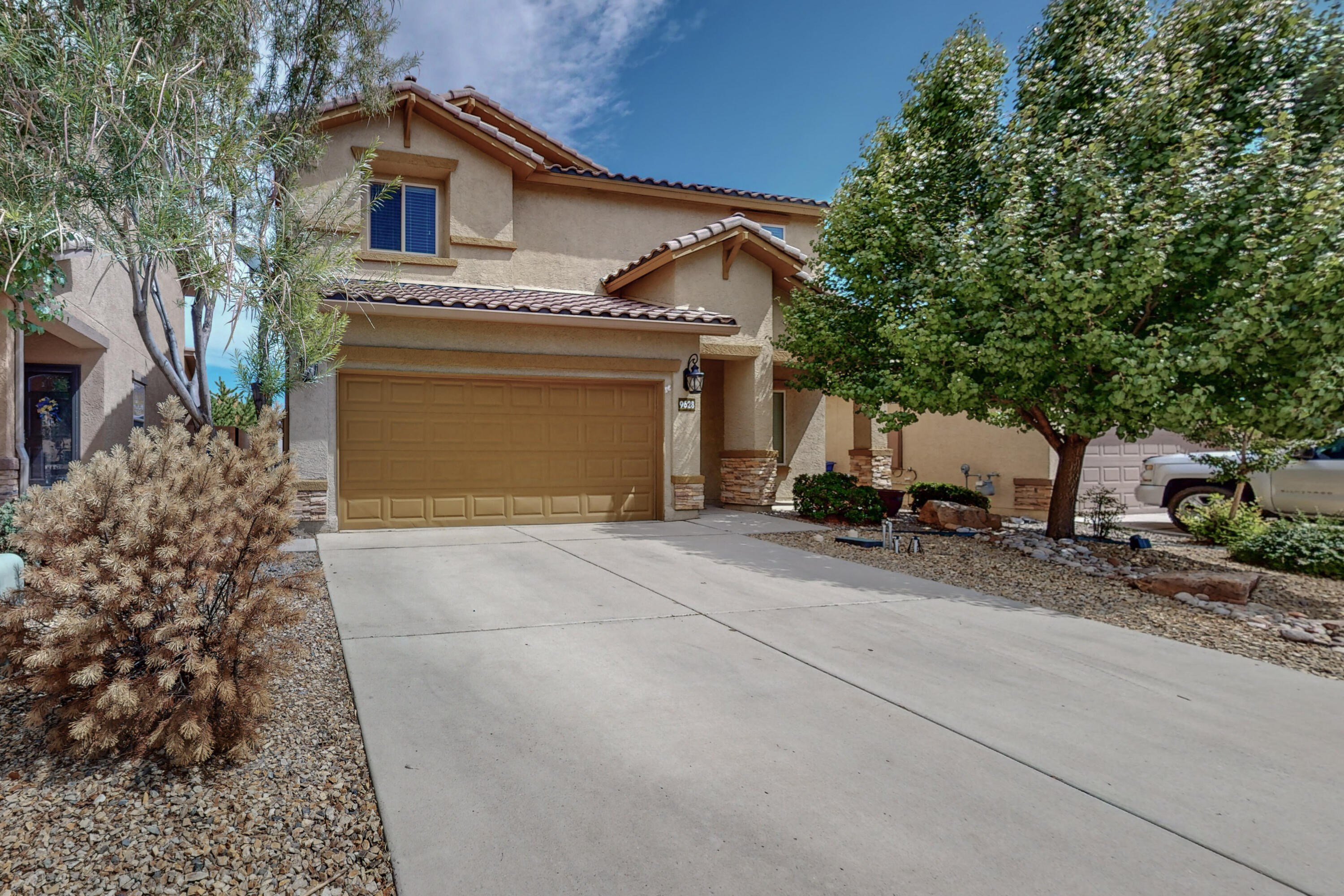 Come home to this gorgeous open-plan home in highly sought out Boulders Subdivision. Every foot of this home is useful and appealing. This stunning property offers 3 bedrooms upstairs as well as a bedroom, full bath and flexible space that could be an office, media room, game room or 5th bedroom downstairs. The spacious and modern kitchen boasts a giant center island, granite countertops, stainless appliances and a walk-in pantry! The massive loft upstairs provides many opportunities for family gathering, kids' space, work space or media area. Enjoy the private backyard with raised wall, storage shed, easy care artificial grass, xeriscape and gas stub out for BBQ, and a garden area. Refrigerated Air! Don't miss this beautiful home!