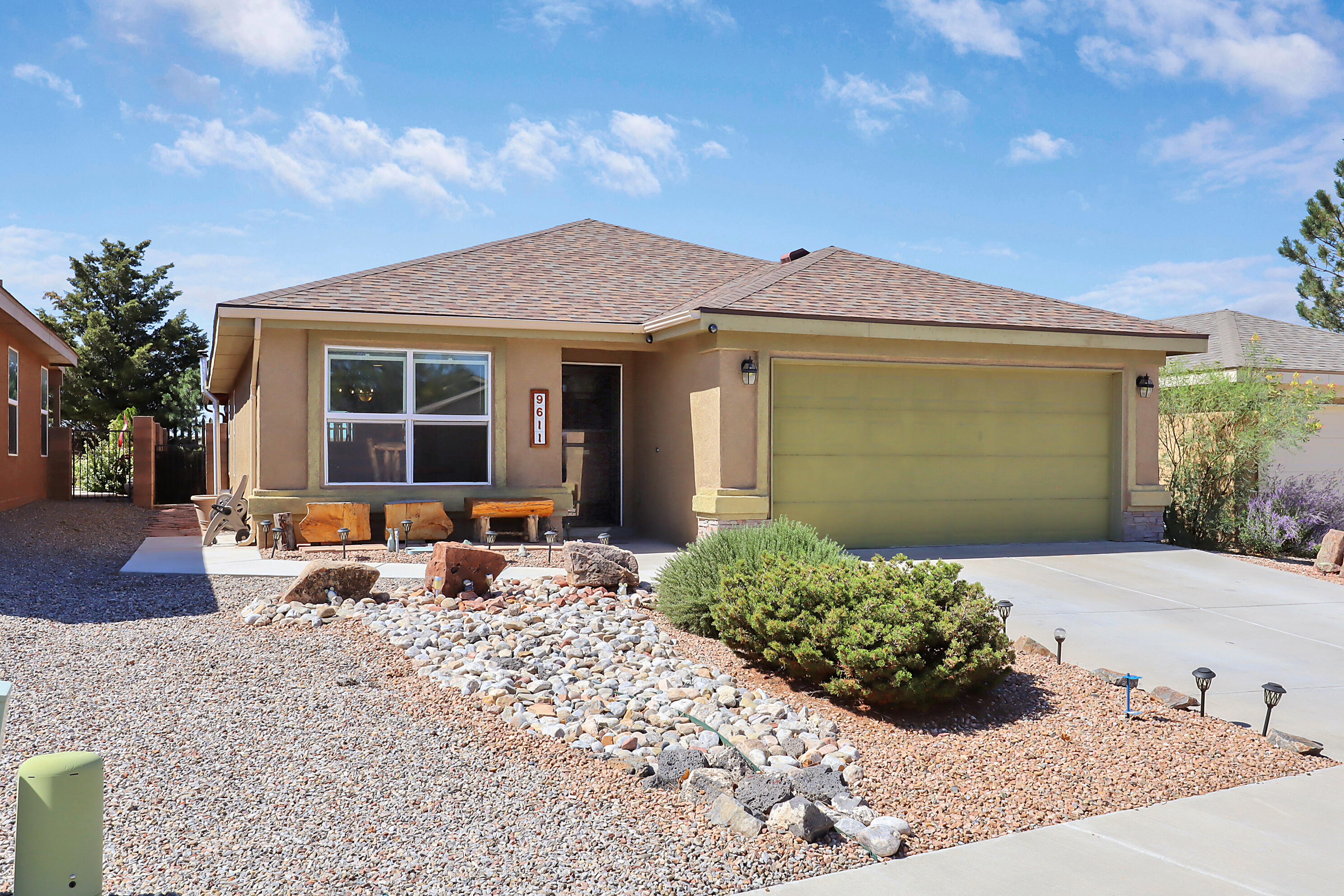 Never worry about the rising rates of electricity again with your own solar array! From the moment you arrive, you're greeted with meticulously-maintained and upgraded landscaping, a gorgeous color scheme, and added sidewalks. When you enter the home, you'll notice zero carpet throughout! Custom ceramic tile stretches through the kitchen, dining, and halls, with luxury vinyl plank flooring in each bedroom and laminate wood-look flooring in the living room. The upgraded kitchen includes new cabinetry. Both bathrooms have been refreshed as well, with stunning custom tile. Cozy up around the pellet stove in the living room on winter evenings. The back yard oasis is a dream, with a fire pit, gazebo, and extended covered patio! Turn the key and move right in to this well cared for home.