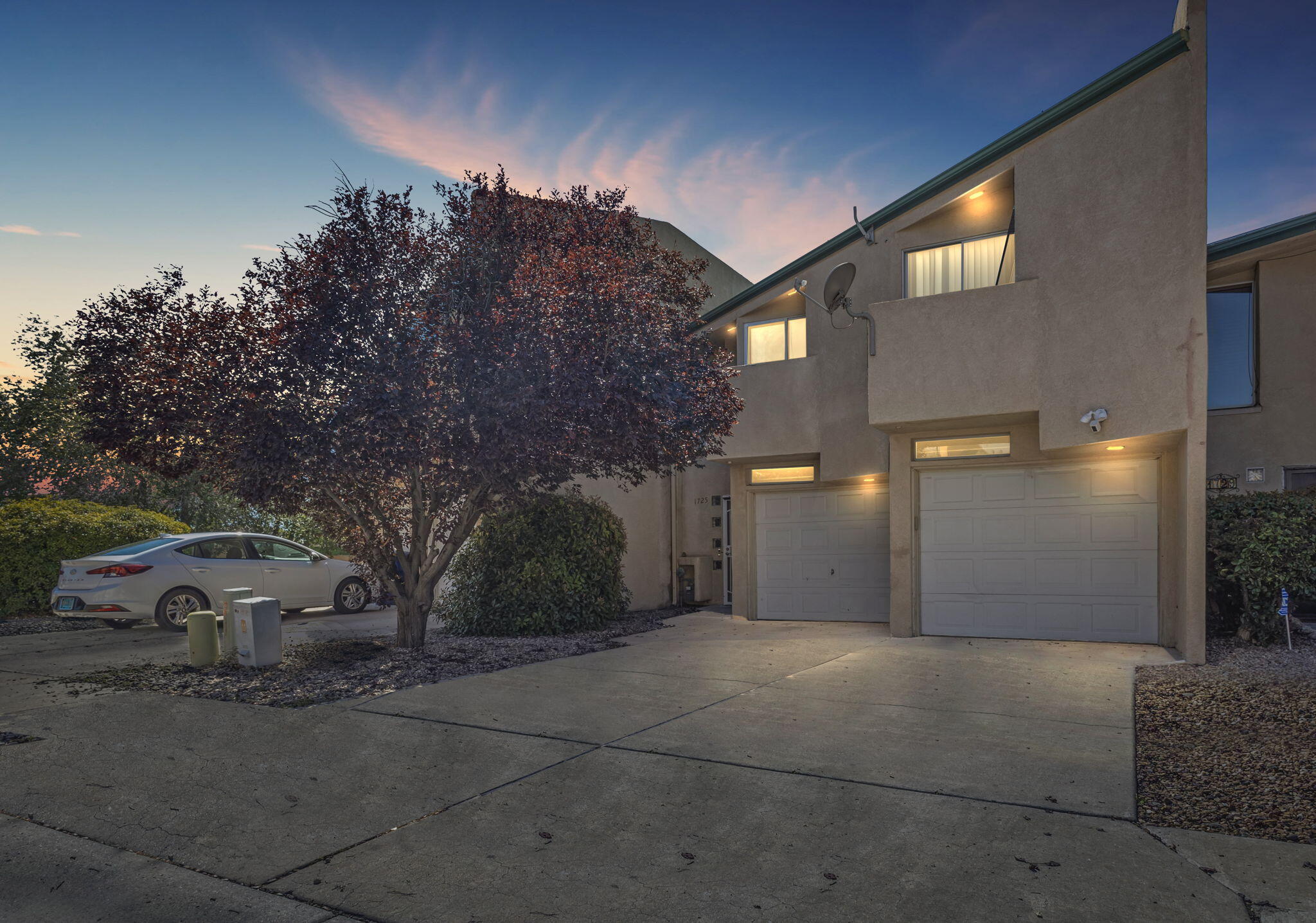 Welcome to your dream townhouse in the heart of Albuquerque! This home offers quick freeway access, so you can enjoy easy commuting while being nestled in a tranquil neighborhood.As you step inside, you'll be greeted by the grandeur of vaulted ceilings, creating an airy and inviting atmosphere. Natural light floods the open floorplan.Each of the three bedrooms has balcony access, providing a peaceful retreat to soak in the NM sunsets or enjoy a morning coffee.The spacious primary suite is complete with an en-suite bathroom for added privacy.Entertain effortlessly in the spacious living area, and the well-appointed kitchen featuring modern appliances and ample counter space. A convenient bathroom on the main floor is perfect for guests. Don't miss out on this amazing deal!