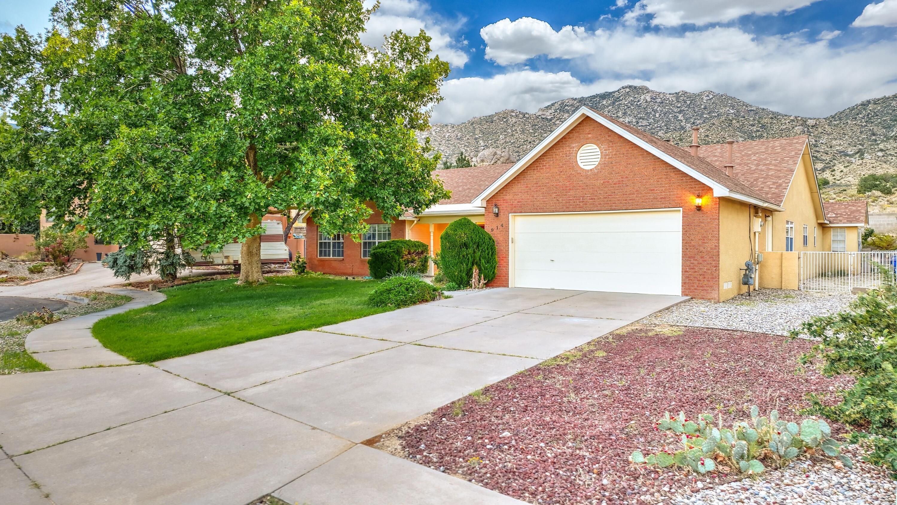 Don't miss this Custom 4 Bedroom One Story Home Backing up to the Open Space in the Foothills with No one living behind you in this beautiful quiet neighborhood. Great for hiking and enjoying the view. Newly Painted home. Primary Suite is Separate from the other Bedrooms for your Sanctuary with a Fireplace and access to the backyard. Large kitchen with dining and brand-new dishwasher, two living areas-both with a fireplace and a separate formal dining/study . Newer 75 Gallon Water heater, evap coolers a year old, roof 3 years old.  Side yard access for RV or Boat storage.