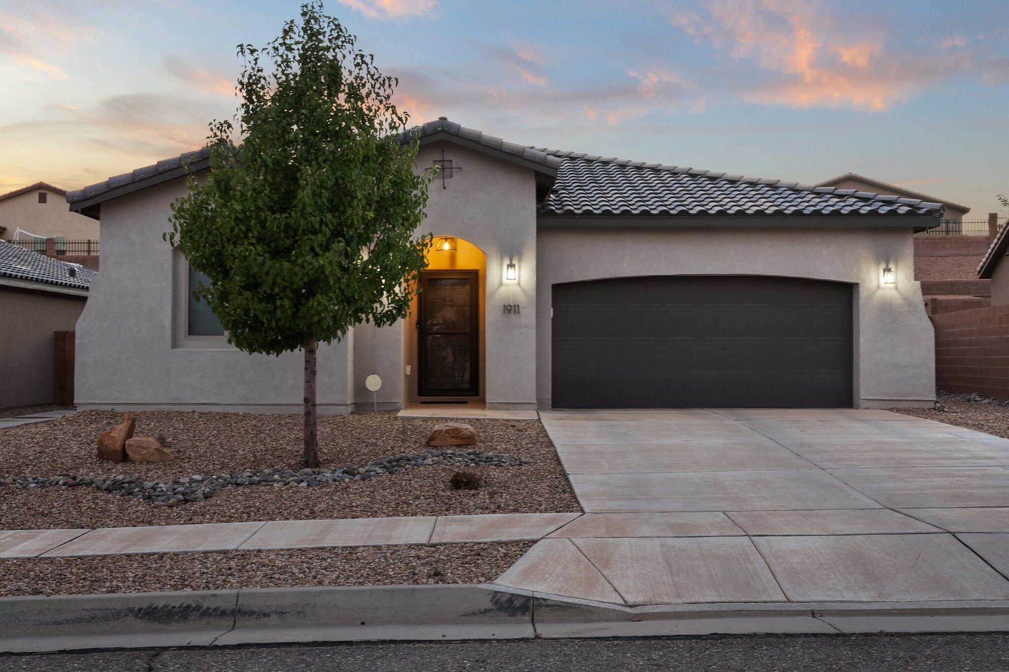 Welcome to 1911 Camino Corona, a delightful residence offering an open floor plan and a meticulously landscaped backyard. Nestled in the heart of one of New Mexico's rapidly growing cities, this property presents a harmonious blend of comfort, convenience, and modern living.As you step inside, you'll immediately notice the welcoming atmosphere created by the well-designed open floor plan. The living, dining, and kitchen areas seamlessly flow together, making this home perfect for both everyday living and entertaining. Abundant windows allow natural light to fill the living spaces, creating a warm and inviting ambiance.The kitchen is a highlight of this home, featuring modern appliances, generous counter space, and ample storage. Whether you're a seasoned chef or simply