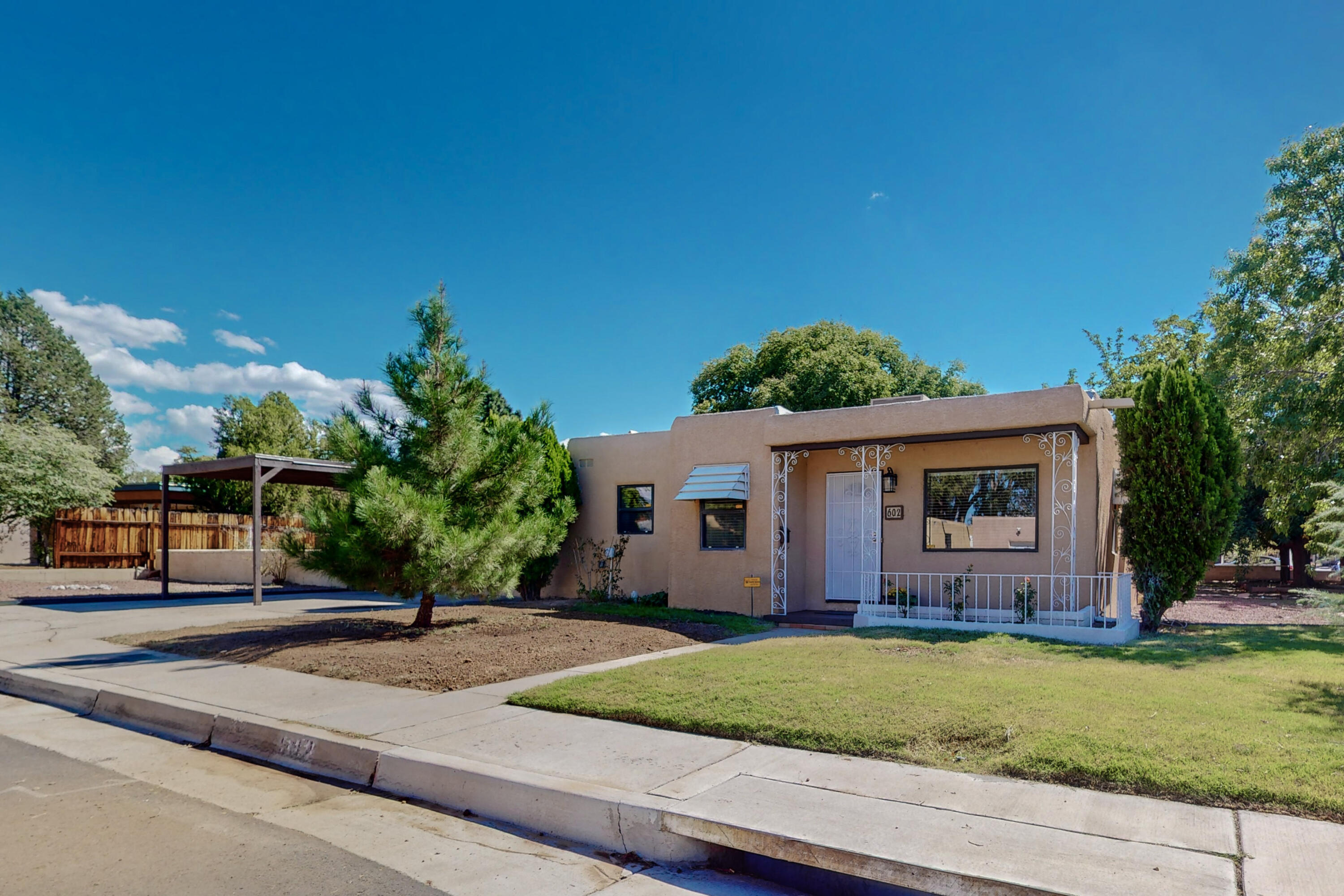 CLASSIC PARKLAND HILLS BEAUTY! Recently updated to include new cabinets & granite countertops in kitchen, new paint, interior doors, hardware, baseboards, blinds, lighting, fixtures. Electric has been updated. Newer A/C, Windows, Stucco & Roof. Original refinished wood flooring adds to the charm of this home. No carpet! Oversized corner lot. Quiet neighborhood near Nob Hill / Ridgecrest / UNM / Kirtland. Schedule your showing today!