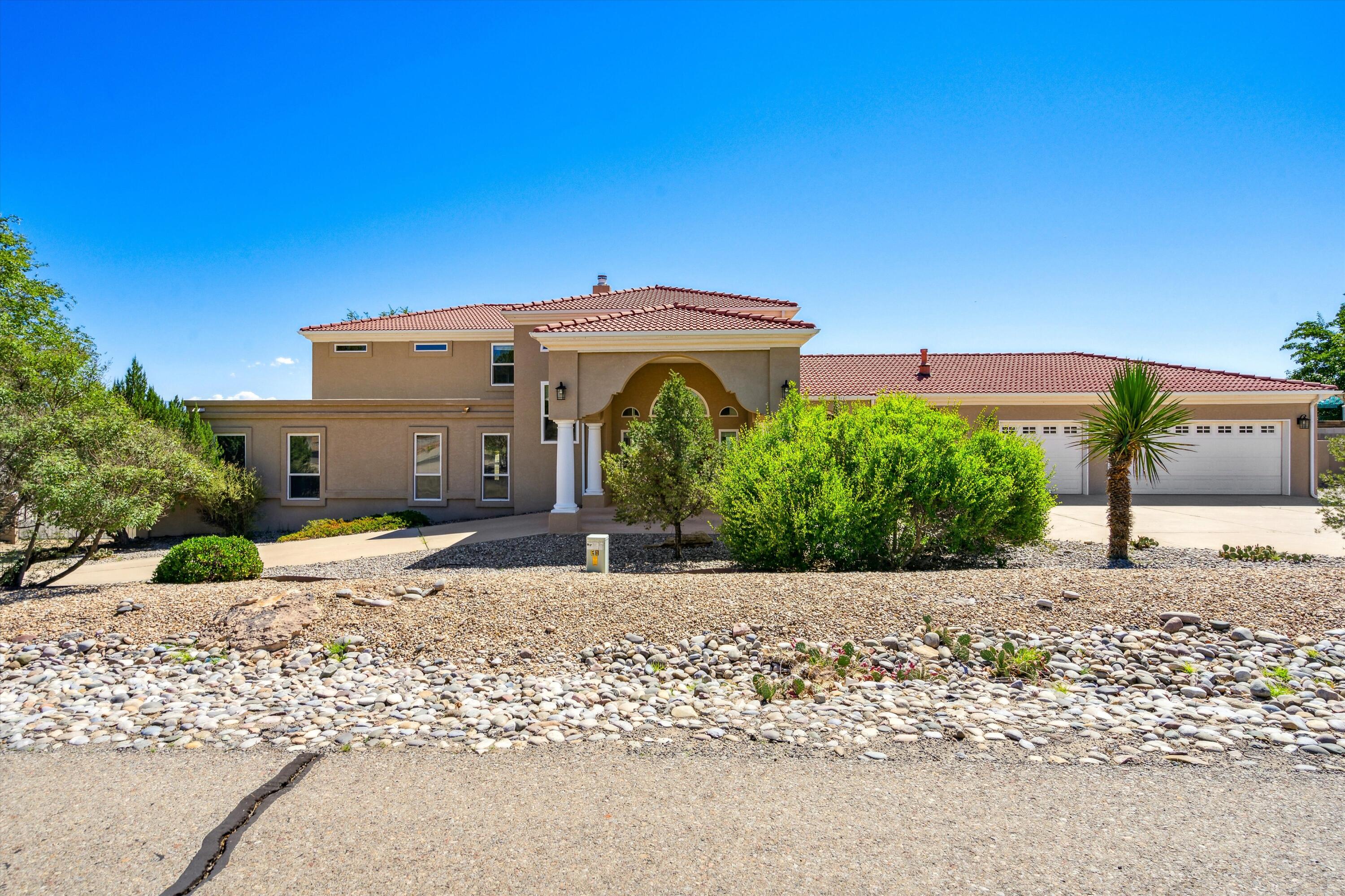 Welcome home to this expansive luxurious estate.  Perfect for multigenerational living!  Situated on two lots with panoramic valley views, this home has it all.  Unique floorplan featuring large bedrooms with plenty of privacy.  Loft area perfect for a home office featuring beautiful custom cabinetry.  Create your personal sanctuary in the primary suite with large walk in closet and  balcony.  The kitchen is made for entertaining and flows nicely to the outdoor living space.  Complete with an indoor pool  and wet bar, this home will not disappoint.  With custom paint and stone accents!  Los Lunas Luxury at it's best!