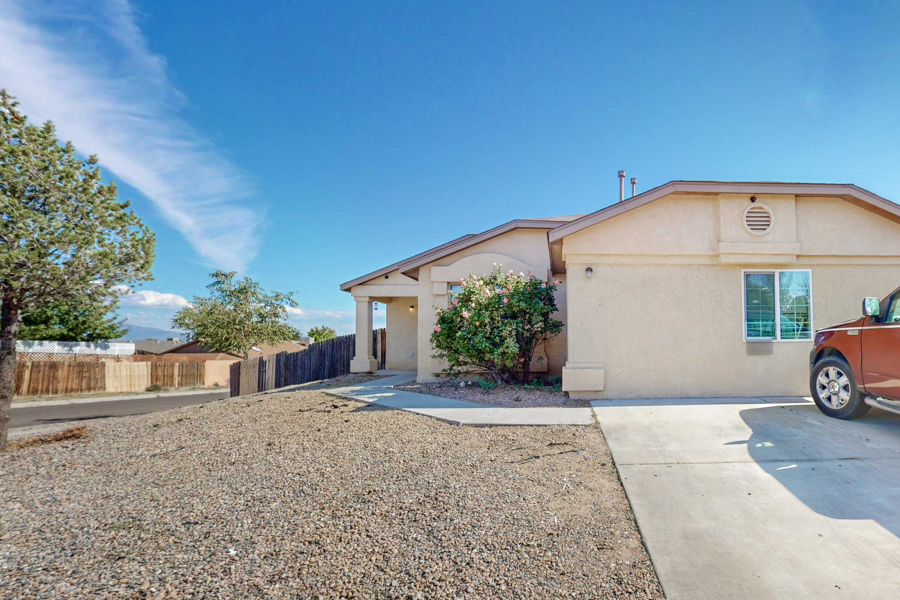 Beautiful home with mountain views. Large open space with vaulted ceilings. Corner lot with back yard access. New air conditioning unit installed in July. Tile and laminate hardwood flooring throughout. Gas range and refrigerator convey kitchen island is not attached but does as well convey.
