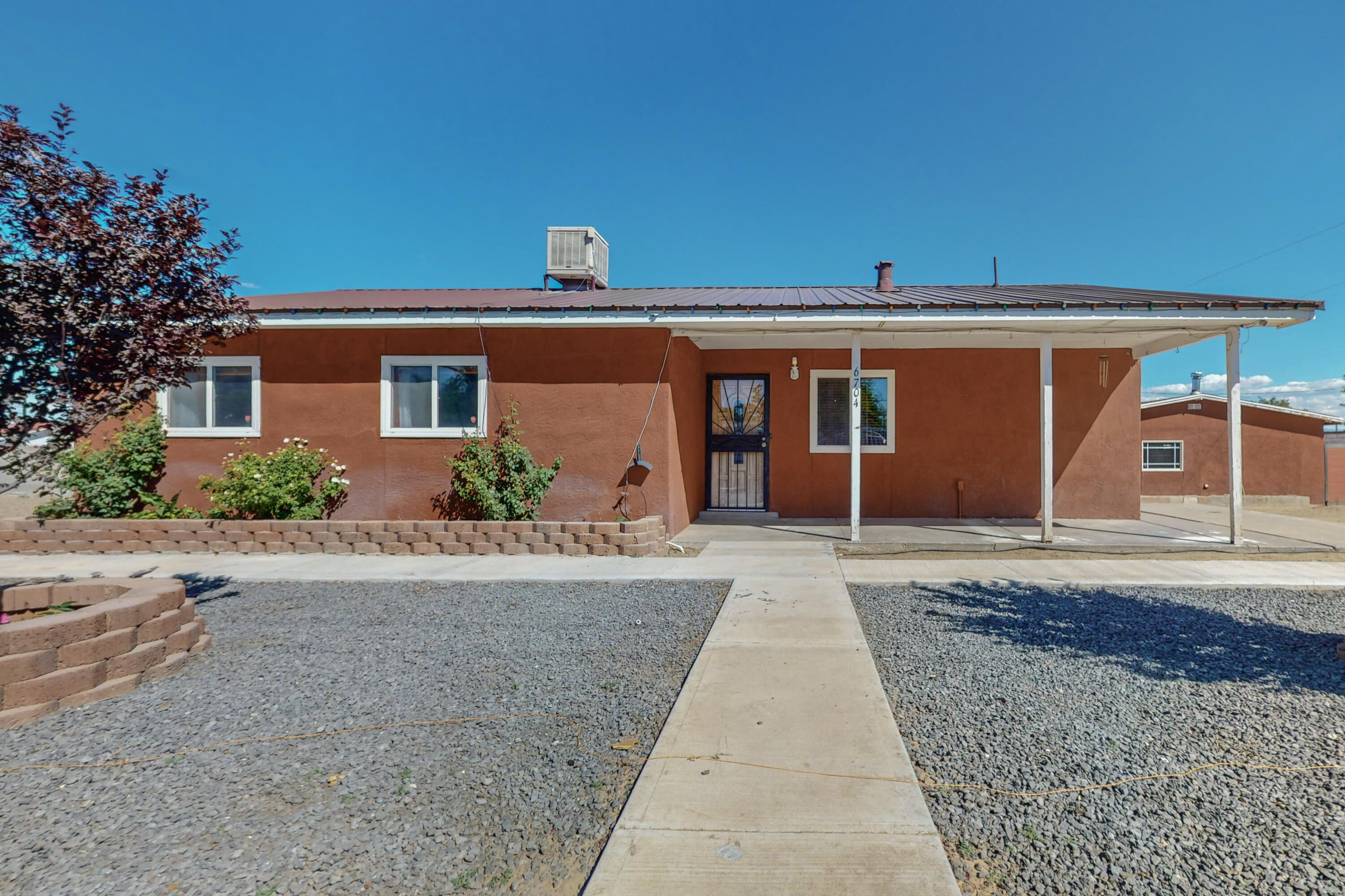 This charming property offers 3 homes in one location with a great potential for income or multigenerational needs. Situated in the SW area of Albuquerque known as  ''Pajarito'', which offers a serene and friendly environment. Main House, upon entering you will be greeted by an open-concept kitchen, with stainless steel appliances. The living room features a cozy pellet stove. 3 bedrooms and 2 recently updated bathrooms. Guest Houses # 1 and # 2 have a living room, bedroom, laundry room, kitchen, and bathroom, The large lot is fenced and has double access to the backyard allowing for plenty of outdoor activities, RV parking and gardening opportunities. There is a private well.