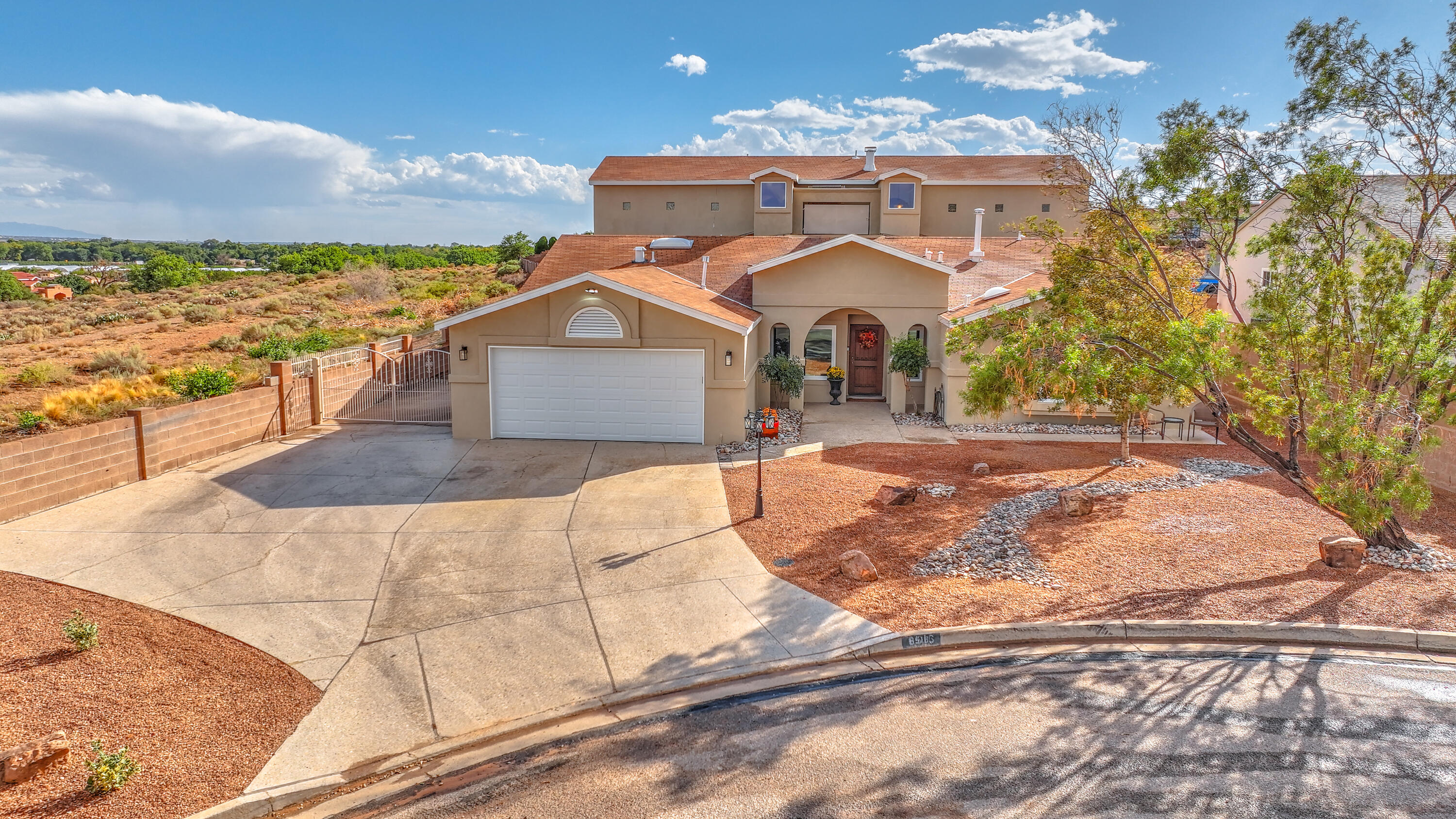 VIEWS, VIEWS, VIEWS!!!! If you are looking for a unique one-of-a-kind property with VIEWS, then this is the property for you.  This 4-bedroom 5 bath home is full to the brim with upgrades including a beautiful all tile pool, top of the line appliances, and two sided saltwater fish tank just to name a few. This very spacious home is situated on a large lot at the end of a quiet cul-de-sac. There is a second primary with en suite on the main floor that also has a private entrance.  Did I mention this house has views?   The panoramic views of the Sandias can be enjoyed from the large kitchen widows, the wall of windows in the upstairs primary bedroom & balcony and is the focal point of the expansive back yard.  You won't want to miss out, pack your bags this one is move in ready!