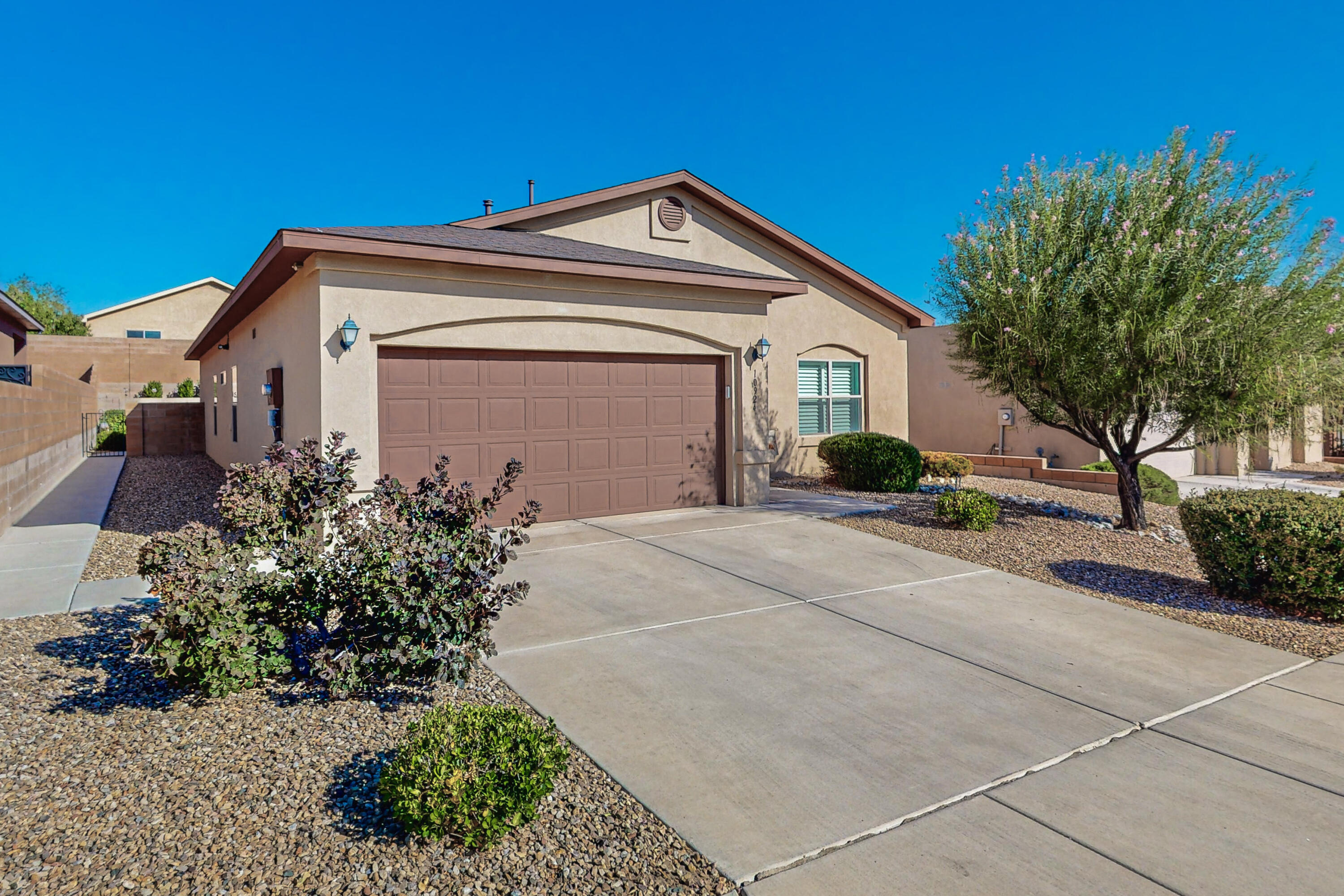 This three bedroom home with open floor plan shows like a model home.  Natural light throughout.  Beautiful plantation shutters in the dining area.  Carpet only in bedrooms. Fresh interior paint.  Large kitchen with plenty of cabinets!  Relax and enjoy the  DreamStyle Swim Spa in your private backyard oasis!