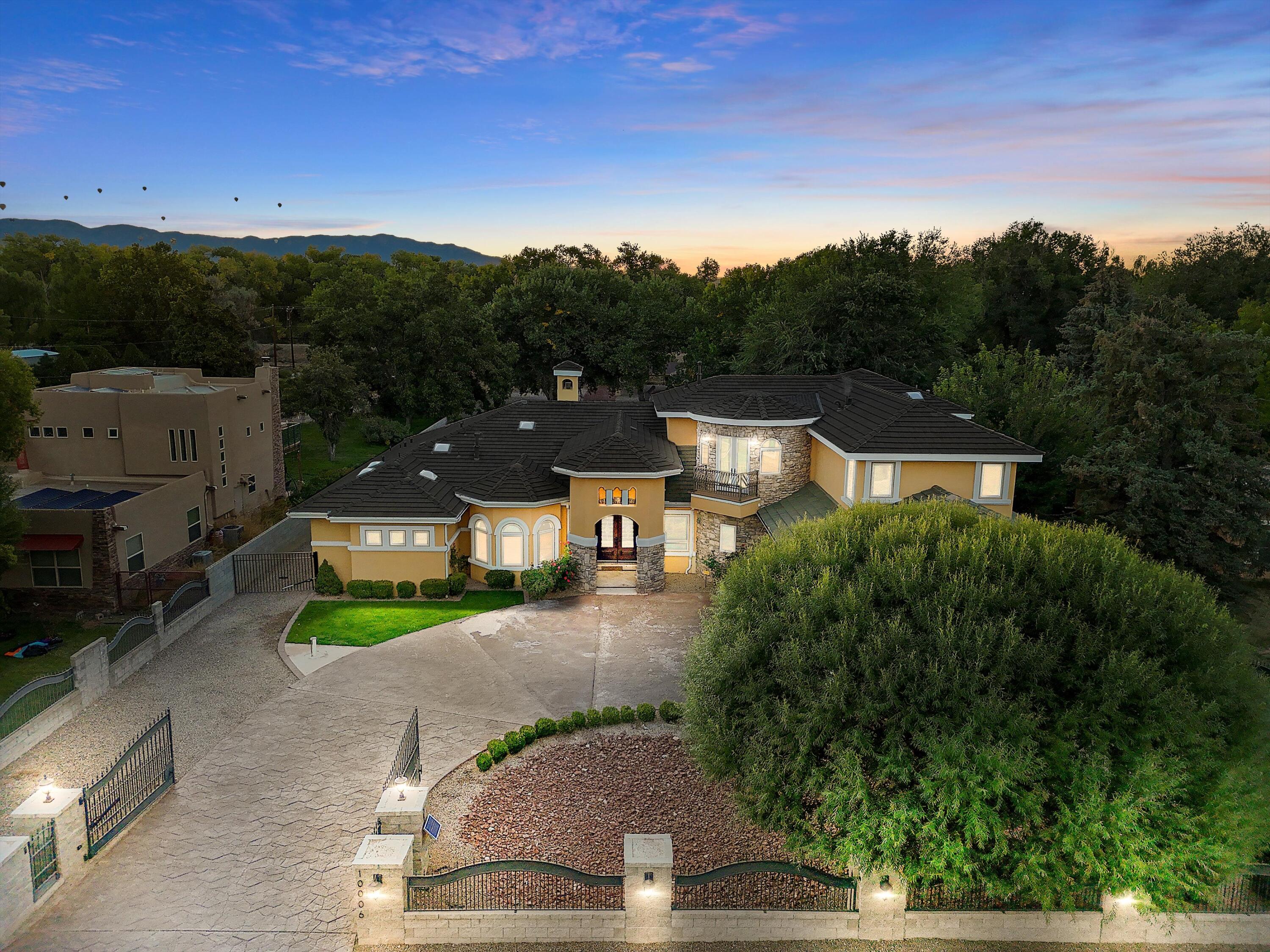 Welcome to an exquisite custom home spanning over 7309 square feet of opulent living space nestled on a generous one-acre lot. This residence boasts a wealth of features, including multiple living areas, a dedicated media room, a fitness area, a versatile loft, and a meticulously designed office or library space complete with built-in shelving. The heart of the home is a chef's dream kitchen, equipped with built-in microwave and oven, instantaneous hot water above a 7-burner gas cooktop, a generously sized kitchen island, and a convenient built-in wet bar. The private owner's retreat is a must-see, featuring a spacious walk-in closet, a separate water closet, and a bathroom that exudes spa-like luxury with a jetted tub and a distinctive snail shell shower. Furniture stays w/full​​‌​​​​‌​​‌‌​‌‌‌​​‌‌​‌‌‌​​‌‌​‌‌‌ price**