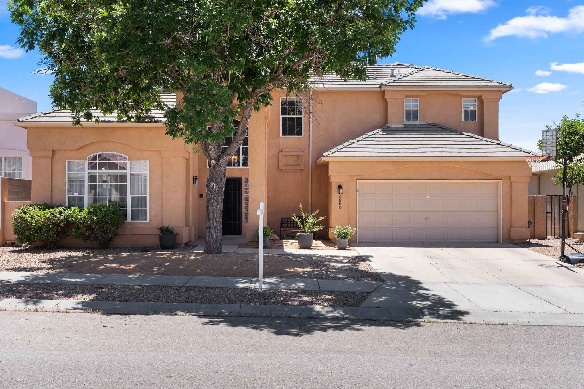 Back on the Market!  Immaculately updated home in the desired Northeast heights and La Cueva school district! This charming 4 bedroom, 4 bathroom home offers the perfect blend of comfort, style, and convenience. Step inside and you'll be greeted by a warm and inviting atmosphere enhanced by the soaring ceilings and beautiful upgrades throughout. The open concept layout seamlessly connects the living, dining, and kitchen areas, creating a perfect space for entertaining guests and spending quality time with family. The spacious kitchen a chef's delight, offering ample counter space. The large primary suite includes a wonderful walk in closet, soaking tub and double sinks. Enjoy the beautiful backyard with newly extended patio. Schedule your personal showing today!