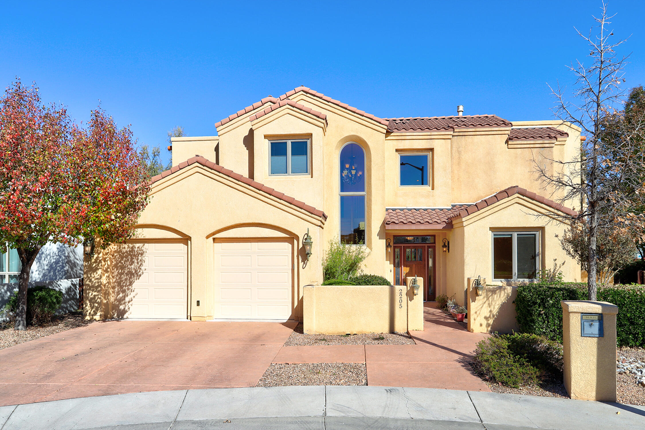 Discover North Valley luxury in this two-story home with a 3-car tandem garage. The hardwood floors, granite countertops in the kitchen, walk-in pantry, and warming tray create a chef's haven. Cabinetry throughout is Hank House. Vaulted ceilings with rustic beams add charm. Upstairs, a library balcony beckons and boasts a cork-floored game room w/ microwave, sink & fridge. The primary suite offers a spa-like experience with double vanities, closet builtins w/ dressing island and a lipless shower for easy, safe access. This ''age-in-place home was expertly built by John Kaltenbach, emphasizing long lasting quality.  Nearby bike trails & Bosque walks beckon outdoor enthusiasts. This home seamlessly blends practicality & elegance, making it ideal North Valley retreat.