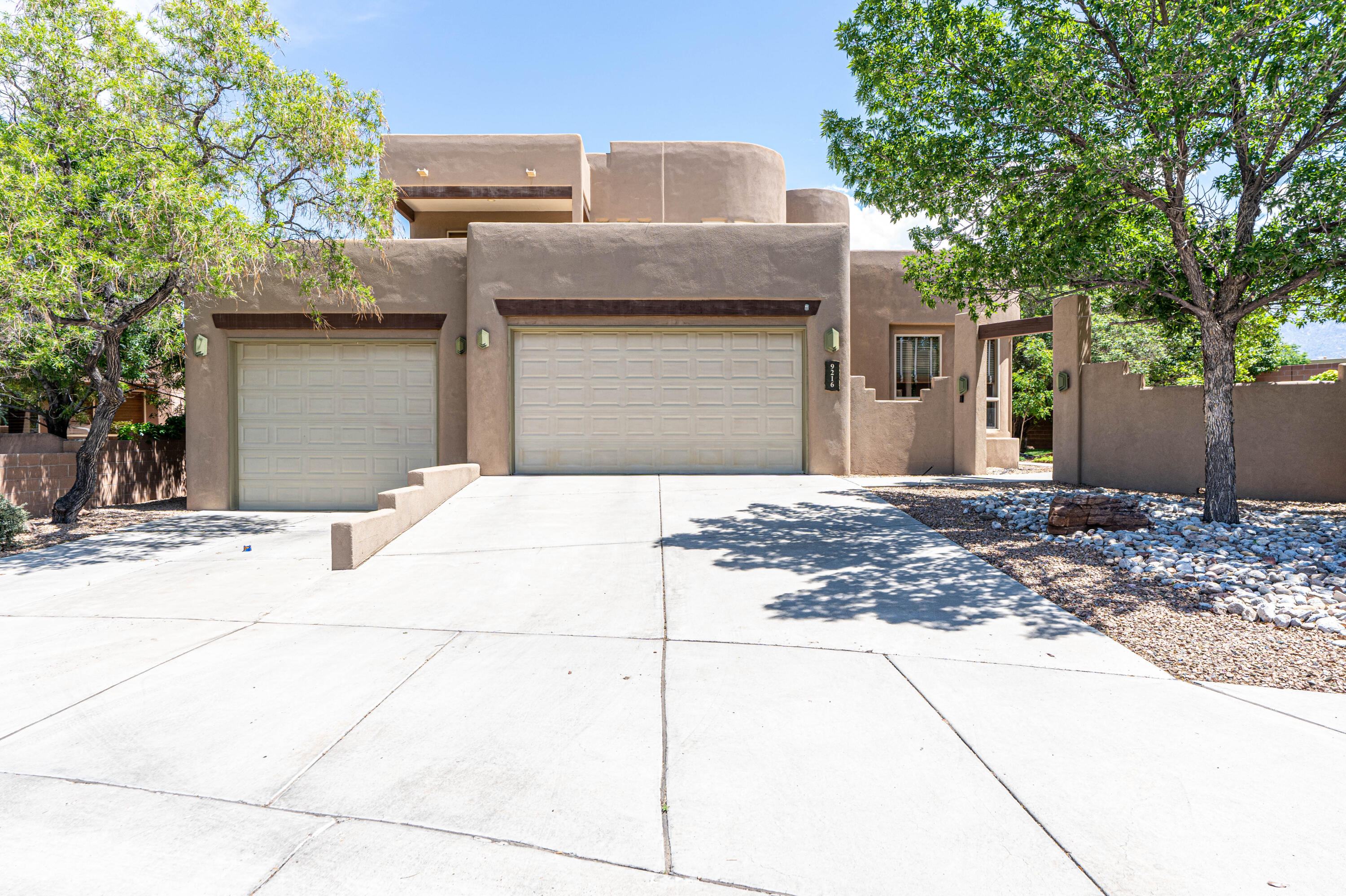 This lovely custom Tiara home has a bright open floor plan. Large living room has T&G ceiling with vigas & gas log kiva fireplace. Gourmet kitchen has hickory cabinets, granite counter tops, stainless appliances including convection oven, refrigerator & microwave. Spacious first floor master suite has large walk-in closet & bath with dual sink vanity, jetted tub & two headed shower. Upstairs has bedroom with two balconies, one with mountain views, bath & family room/loft with wet bar, gas log kiva fireplace and balcony. Beautifully landscaped yard with lawn and trees plus large covered patio. 2-car garage plus 3rd car garage large enough for 2 cars tandem or a boat. New TPO roof 2021, with transferable warranty. Owned Solar array 5.7 KW. See list of more recent upgrades in Documents