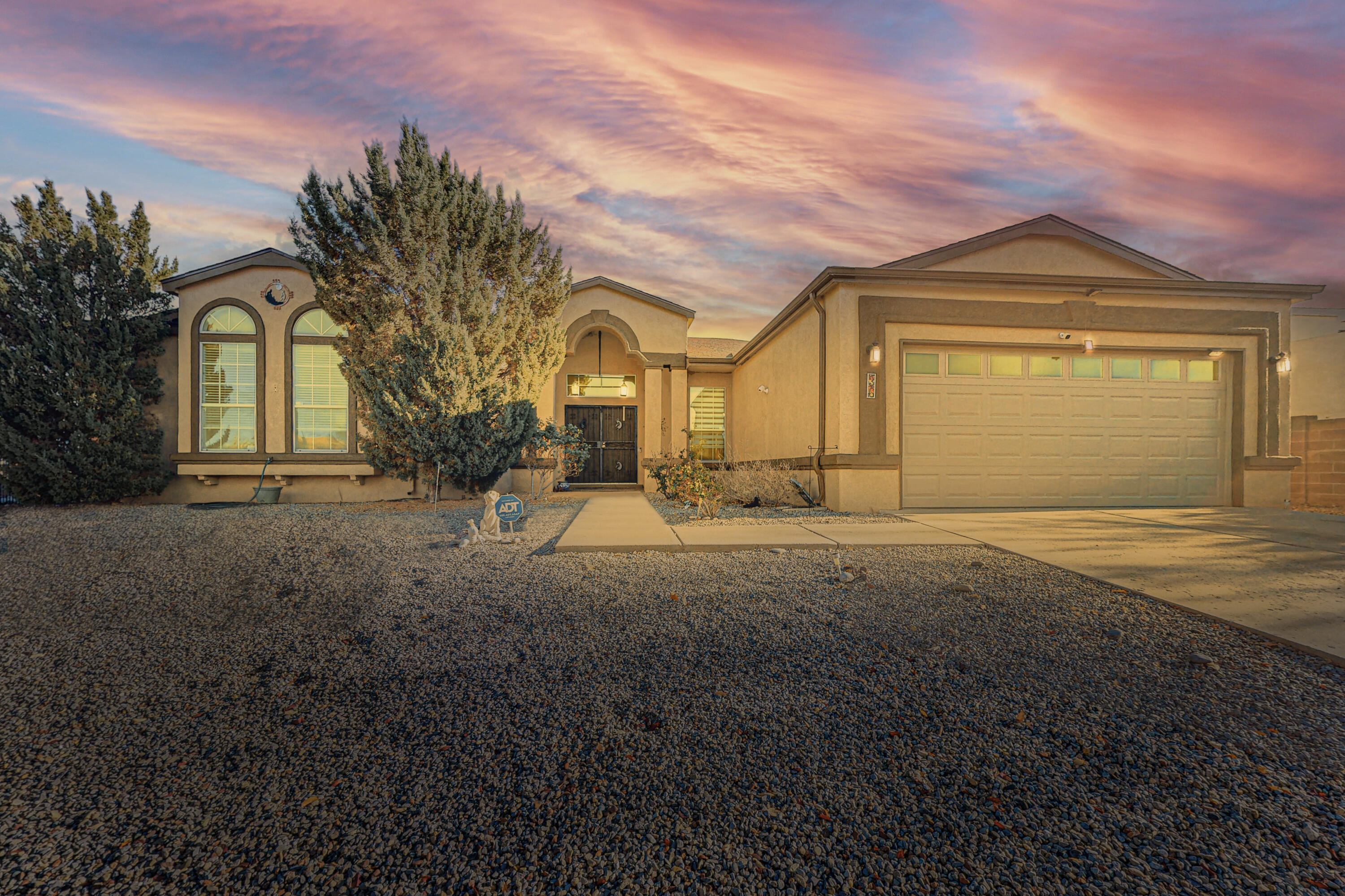 Welcome home to this large 4-bedroom home with gorgeous views of the Sandia Mountains! Home is located on a corner lot and has a great floor plan with an open living concept that features a family room, living room, formal dining room and a sunny sitting area perfect for a studio, play area, or office. Kitchen has silestone countertops with a built-in workstation that overlooks the living room and leads to formal dining room with tray ceilings. Hardwood floors in all 4 bedrooms, hall, family room and living room. Gorgeous xeriscaped backyard with turf, shed and great views. New refrigerated air system and newer roof and water heater (2020). No poly pipes. Schedule your showing today!