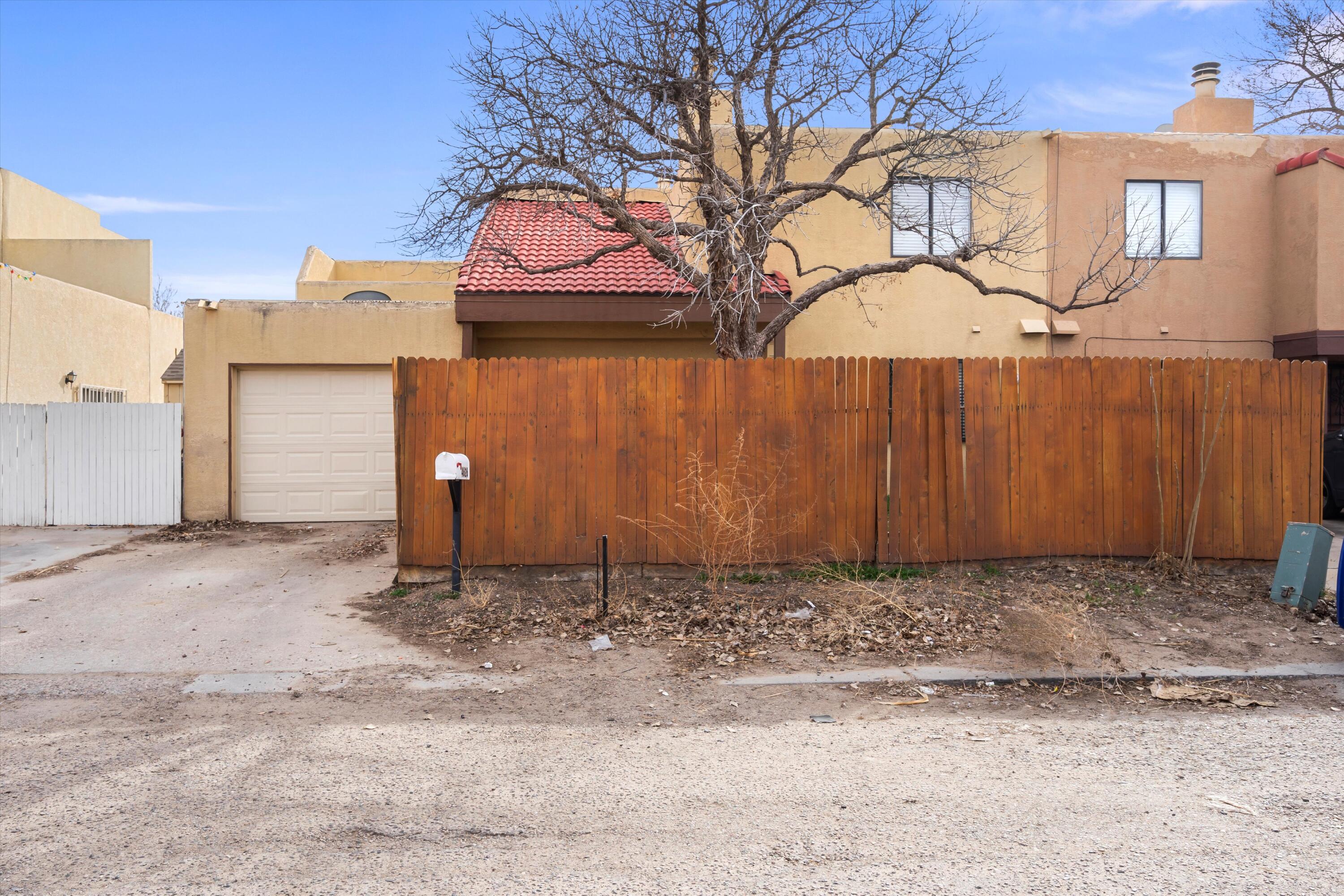 CHARMING SOUTHWESTERN STYLE TOWNHOME! This cozy 2 bed, 1.75 bath casa has an inviting layout with an open living, dining, and kitchen area, perfect for all your needs. Enjoy the warmth of the kiva fireplace and the elegance of tile flooring throughout. Step outside to relax on the upstairs balcony or retreat to the cozy loft space. With an enclosed front courtyard and backyard, privacy is guaranteed. Conveniently located just minutes away from freeway access, shopping centers, dining, and picturesque Bosque trails, this property offers the ideal blend of comfort and convenience. Don't miss out on the opportunity to make this your new home! Call now!