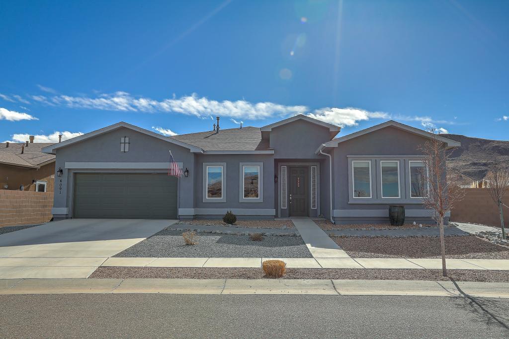 This upgraded home is in Jubilee, a 55+ Community.  This must-see residence sits on a large corner lot and offers:Large living area open to Living Room with corner fireplace, Dining Room, and Kitchen. Kitchen has quartz counter tops, built-in double oven/microwave, tile backsplash, built-in gas stove with stainless steel hood, upgraded cabinets and a large pantry.  2 Large Bedrooms. Master bedroom has walk-in closet. 2.5 Bathrooms. Ensuite master bathroom has two sinks, large shower with bench, and built-in makeup vanity with lighted mirror. Den with white sliding barn doors.2 indoor Storage Rooms. Tile floors in all common areas, bedrooms have carpet. 2 Car Garage. Water Softener System. Patio with Hot Tub, Fire Table, and electronic SunSetter Awning. Blocked fenced-in yard-2  gates.