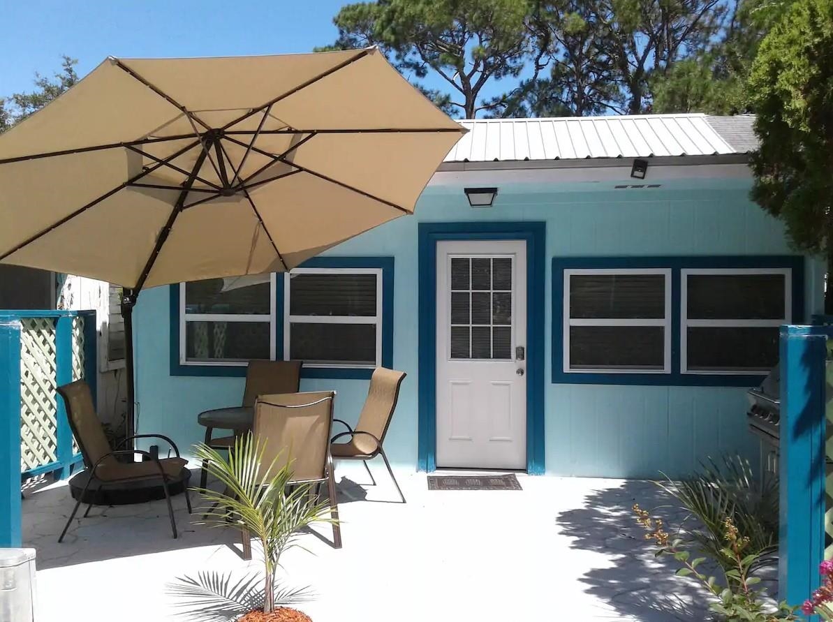 Wow - A Charming Florida style beach cottage for only $160,000! This 2 bedroom, 2 full bath converted Army barrack has over 900sf of renovated & well laid out living space.  2015 metal roof, Central HVAC, updated electrical & plumbing are among a long list of updates & renovations. There are tile floors throughout the unit & the back porch area has been converted to accommodate a stackable washer/dryer. This unit has been used as an AirBnB with over $1,000 per month rental income for 2021.  With the coastal decor and within 1/2 mile of the water, this unit is perfect for those long weekend getaways or continue to use as a vacation rental.  Carrabelle &SGI white sandy beaches are less than 30 minutes away.  Come and enjoy the quaintness of the Forgotten Coast. Measurements are approximate & should be verified if important