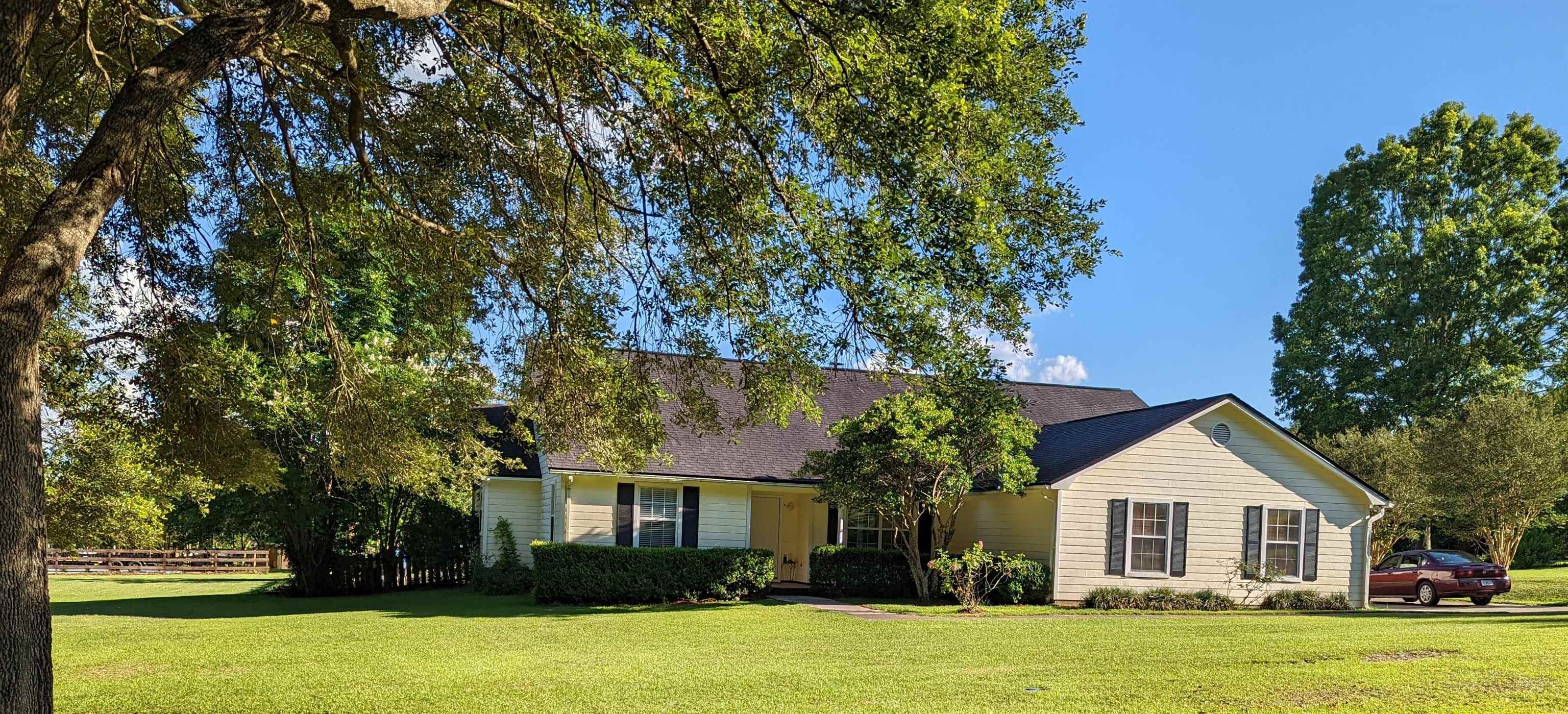 Perfect family home! 4 bedrooms, 2.5 baths, 2-car garage, 1.05 acres, screened-in porch overlooking beautiful backyard with swimming pool, small lake and fantastic view! Split plan. Large kitchen with super size pantry! Roof in 2013! 2021 Stainless Steel kitchen appliances!  New pool liner in 2018.  The walls have a fresh coat of paint.   New carpet in all bedrooms and hallway.  AS IS.  Must see! Must see!