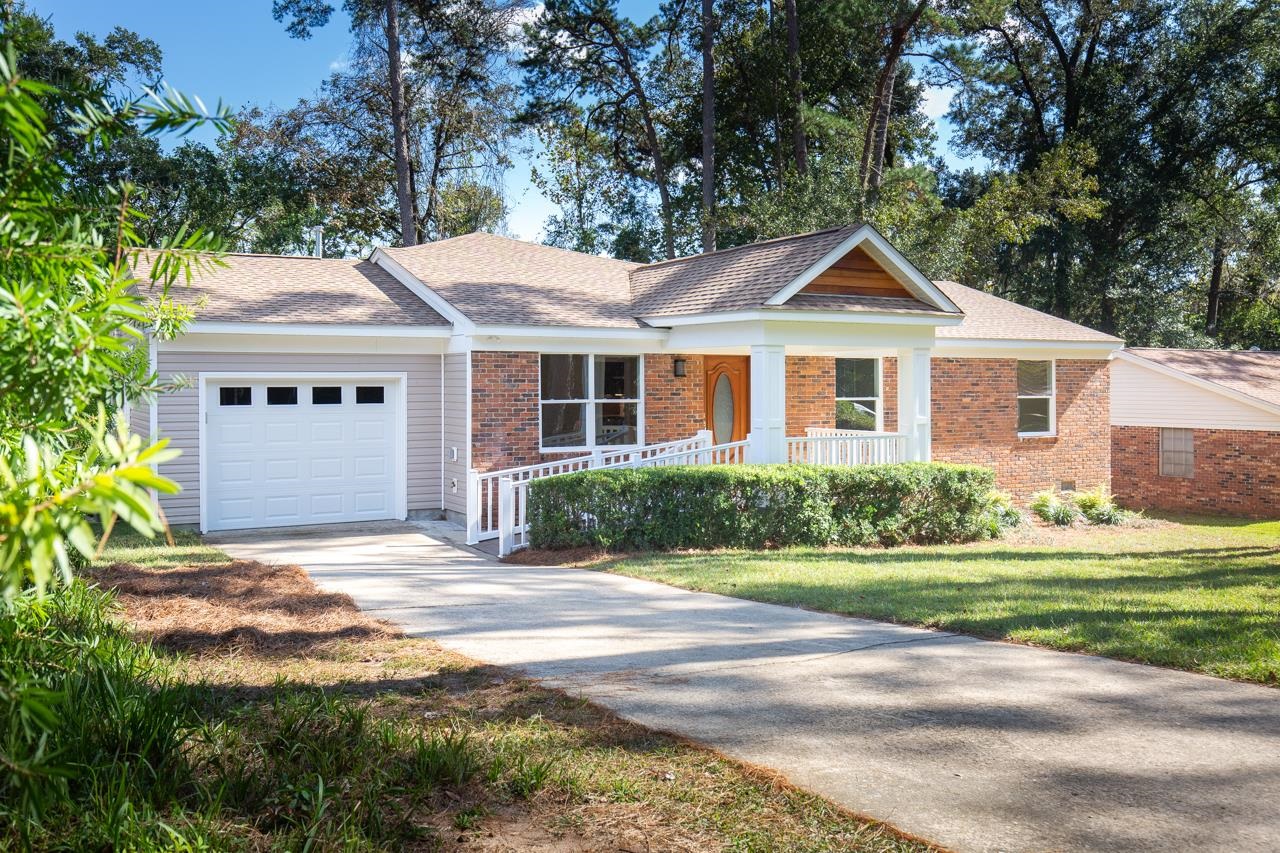 Immaculate turnkey, virtually new 4/3 home! Close Midtown location - walk to TMH, medical offices, schools, parks, restaurants, and shopping! Roof 2022, HVAC 2022, ductwork 2022, hot water heater 2022 with split floorplan, huge family room, eat-in kitchen, curbless master shower with dual shower heads, inside laundry room. This gorgeous home meets ADA accessibility standards and has a stunning mahogany front door, all new luxury vinyl plank flooring, tile, appliances, countertops, light fixtures, fans, vanities, tiled showers, bathtub, windows, cabinets, doors, plumbing, electrical, siding, subfloor, and a lot more! All appliances are guaranteed for a year by the manufacturer! This move-in ready house has been meticulously rebuilt and re-imagined by Carpenter’s Construction, Tallahassee’s most award winning remodeling company for the last two years. Enjoy the comfort of peace and tranquility at its best within this beautiful home!