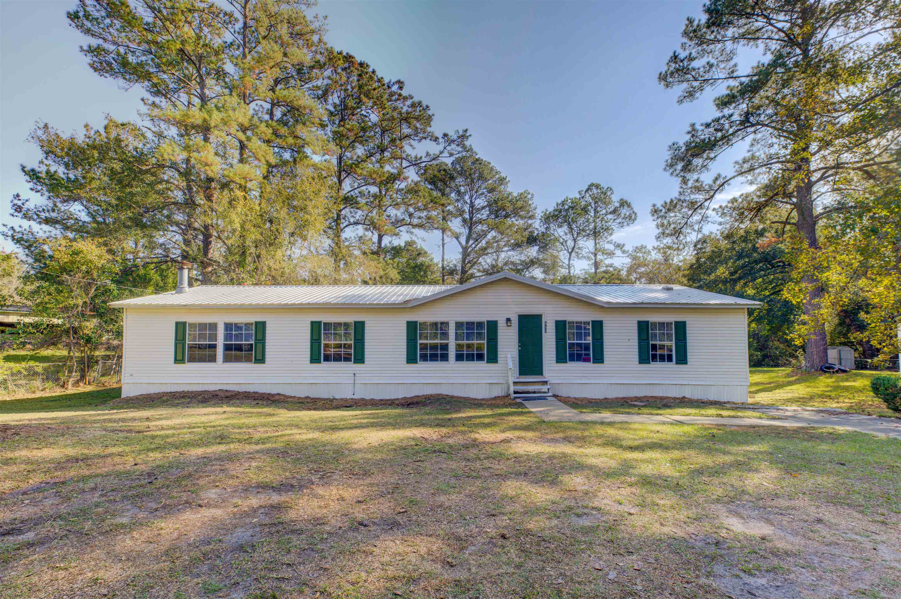 Charming 3 bedroom/2 bath home. Spacious bedrooms Newly renovated floor plan including brand new flooring, freshly painted interior, and a newly installed roof and central air conditioning. Dining area is complemented by a lovely fireplace opening up to a divine kitchen area. Backyard has plenty of space, and is perfect for children or pets. This beautiful home is ready and waiting for its new owner!    Buyer has to verify room dimensions.