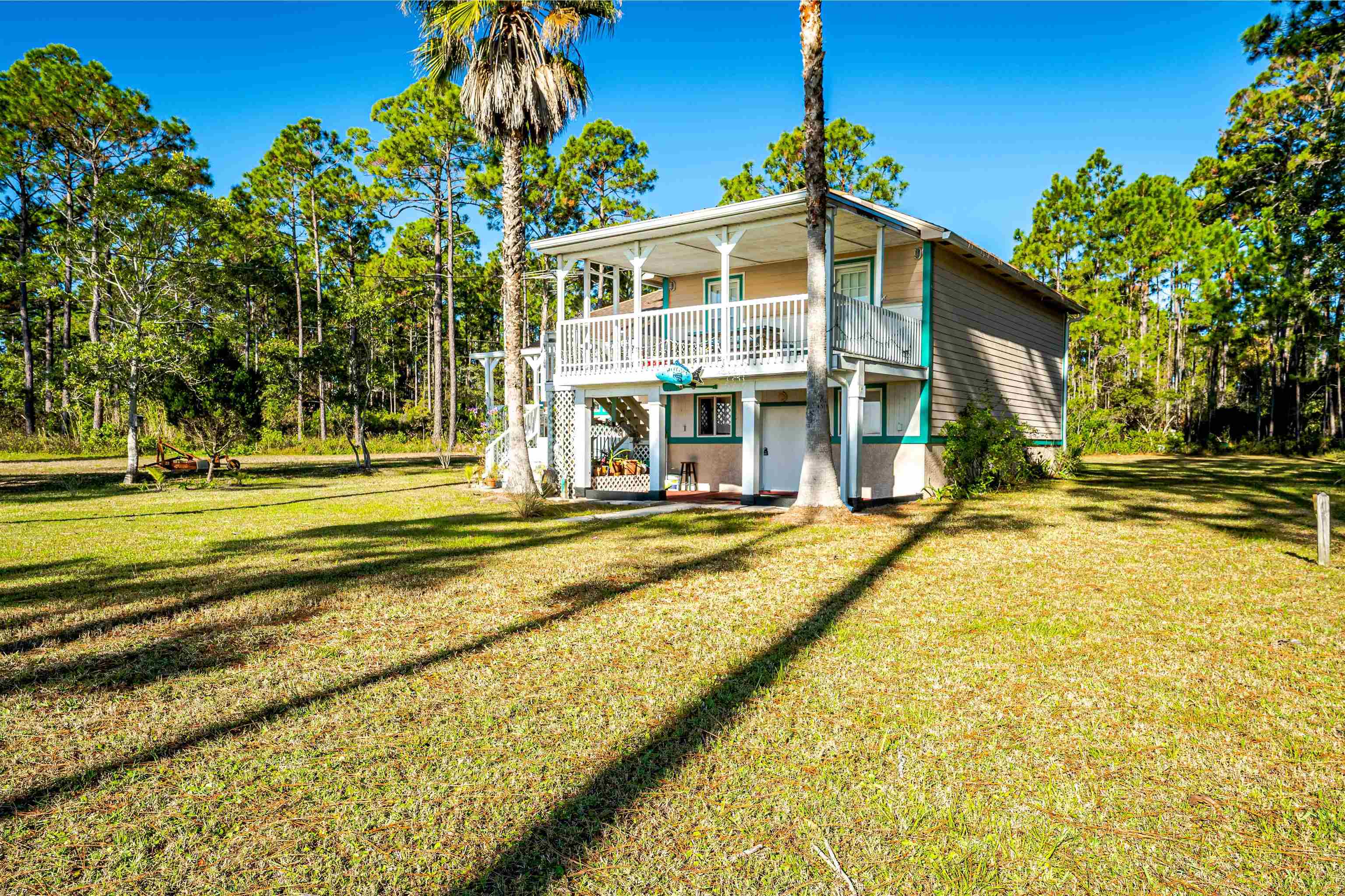 Check out this Old Florida beauty located on Highway 98 on the stretch of land between Carrabelle Beach and Eastpoint.  This 3 bedroom, 2 bath cottage is on 1 acre of land with a million dollar view & its very own private piece of beach.  This split floorplan cottage is spacious and would make anyone a fine family home or vacation destination! Located minutes from the picturesque coastal community of Carrabelle, you could own your very own spot on the Florida Panhandle's gateway to the Gulf of Mexico!