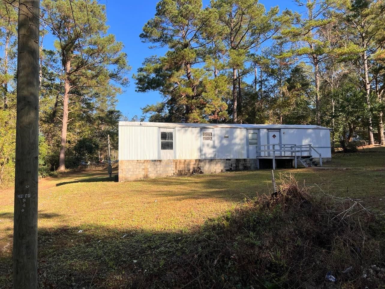 ****Investment Opportunity***** Rental Income***** Estimated rental rate of $650 a month, this 2br, 2ba home is move in ready! Nearly an acre of land on a quiet street.  Recently vacated, home is in good condition, needs some cleanup.  No leaks, 3/4inch plywood flooring, home will be sold "as is" - Seller has maintained this property and collected rent since 2007, has never had a problem renting it out.