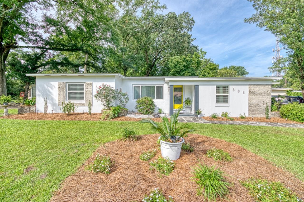 Mid Century Modern Charmer in Popular Midtown!  This 3 bedroom, 1 bath home is on a large corner lot with lush grass, fenced in backyard, plenty of parking, and new roof in 2018.  Come see the many updates this well cared for home has to offer: 2021 Plumbing Repiped, New Windows, New Ductless Mini Split Unit, New Concrete Driveway, and Updated Electrical! Original hardwood floors and built-ins add to it's amazing beauty and charm. Spacious rooms, split bedroom plan, tankless water heater and much more.  Super convenient location where you can walk to the gym, many restaurants, grocery shopping, and entertainment. Live in the middle of it all!!  Schedule your showing today! Open House Saturday 5/20 12-4.