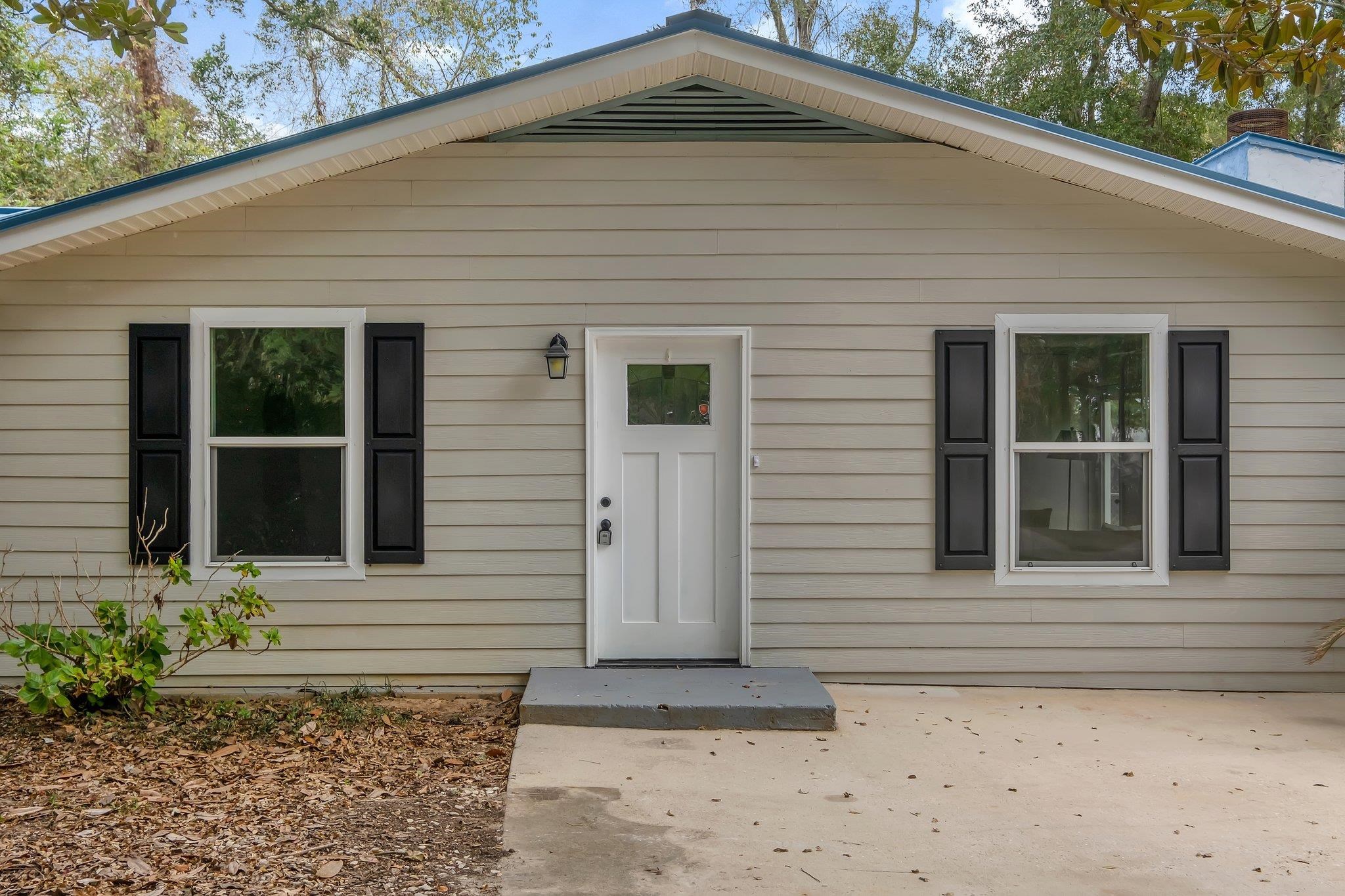 Move in ready home on a large, fenced in corner lot!  This 3/1 offers a ton of space. Inside are 3 bedrooms, and a bonus room. In addition to the 1493 square feet of heated and cooled space, there is 200 sq foot sunroom that is already wired for a window unit if the new owner desires. The home has brand new Stainmaster carpet in the living and bedrooms and a dark laminate through the rest of the living spaces. The kitchen has brand new appliances and white shaker cabinets. The bathroom has been recently updated and there is new paint and light fixtures throughout the home. The siding is hardie board and the windows are new as of 2017. Home has a metal roof and a brand new water heater! Come see it today!