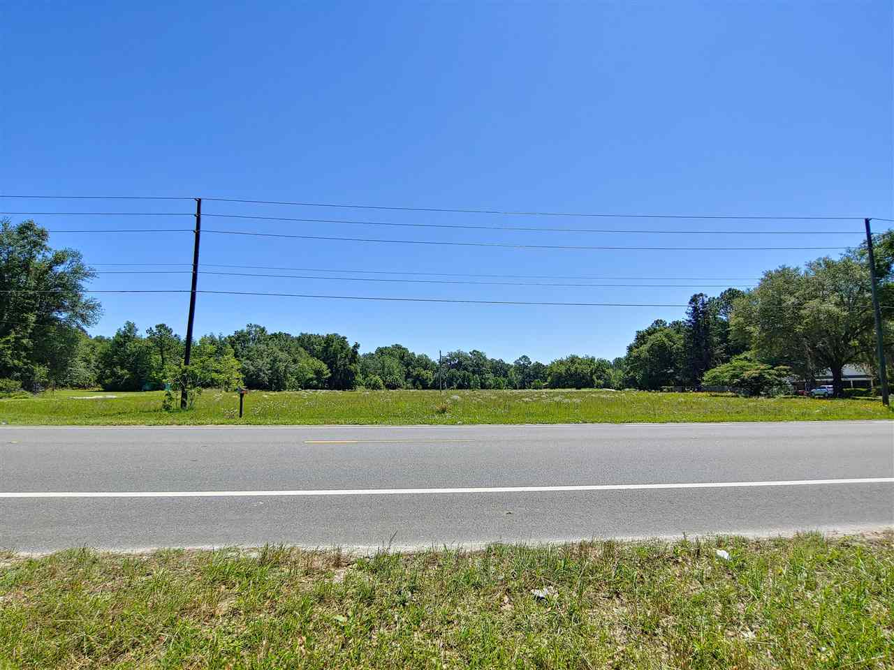 4.26 Acres on desirable North US 221. Beautiful cleared grass acreage. Great for Commercial or Residential.  Zoned Mixed Use - Urban Development, 2 units per acre - Can be subdivided. Not in a Subdivision, No HOA, cleared with some established grass, 30' Easement on South boundary. Lot dimensions are aprox.  Buyer to verify dimensions and land use/zoning. Please notify agent before walking the property.