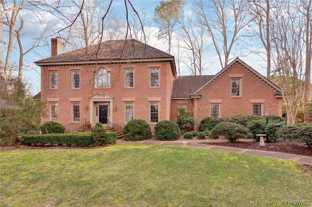 Classic traditional Williamsburg style with transitional floor plan.  This all-brick home offers 4 bedrooms with 3 full baths with hardwoods throughout.  There is a first-floor guest room with access to a full bath that is currently used as an office.  The living room with built-ins and wood burning fireplace flows to the formal dining room that has access to the large composite deck.  The family/flex room off the dining room, is the perfect den, playroom, or home office.  The kitchen is well equipped with double ovens, gas cook top, and abundant storage, flows to casual dining, currently a cozy seating area.  Separate stairs lead to a large bonus room.  The second floor offers the primary bedroom ensuite, walk in closet with additional storage, and separate vanities. Two guest bedrooms, hall bath with direct access to one bedroom.  This move in ready home has a natural gas generator, and storage bins attached to the deck for your peace of mind and convenience.  Beautiful City location, minutes to CW, W&M, or Walsingham.